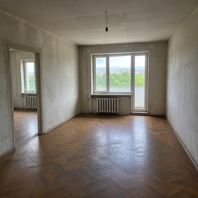 An empty room after old furniture removal, Almaly district