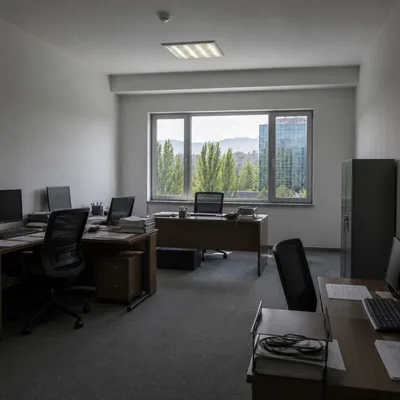 Office desks and chairs in an office on Abai before removal